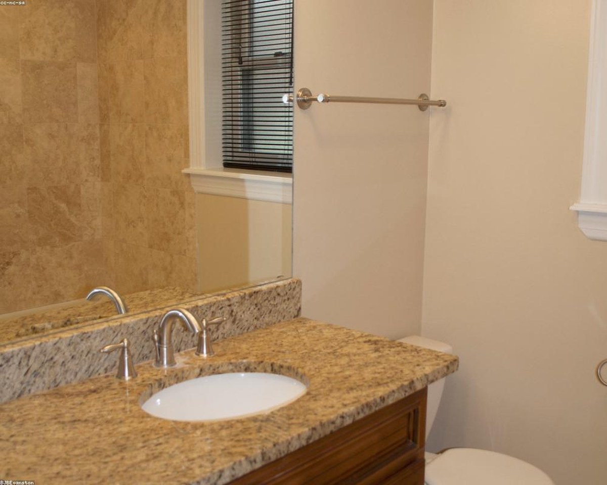 Folded towels and cleaning supplies in a beach rental